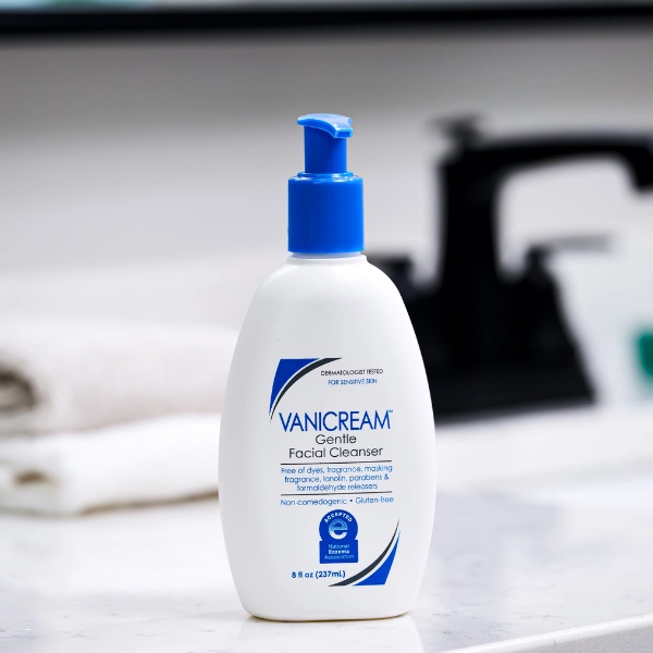 A bottle of Vanicream Gentle Facial Cleanser with a blue pump sits on a bathroom countertop, featuring a clean, minimalist design. The label highlights its dermatologist-tested, fragrance-free, and non-comedogenic formula, making it suitable for sensitive skin. | Is Vanicream Cleanser good for skin?